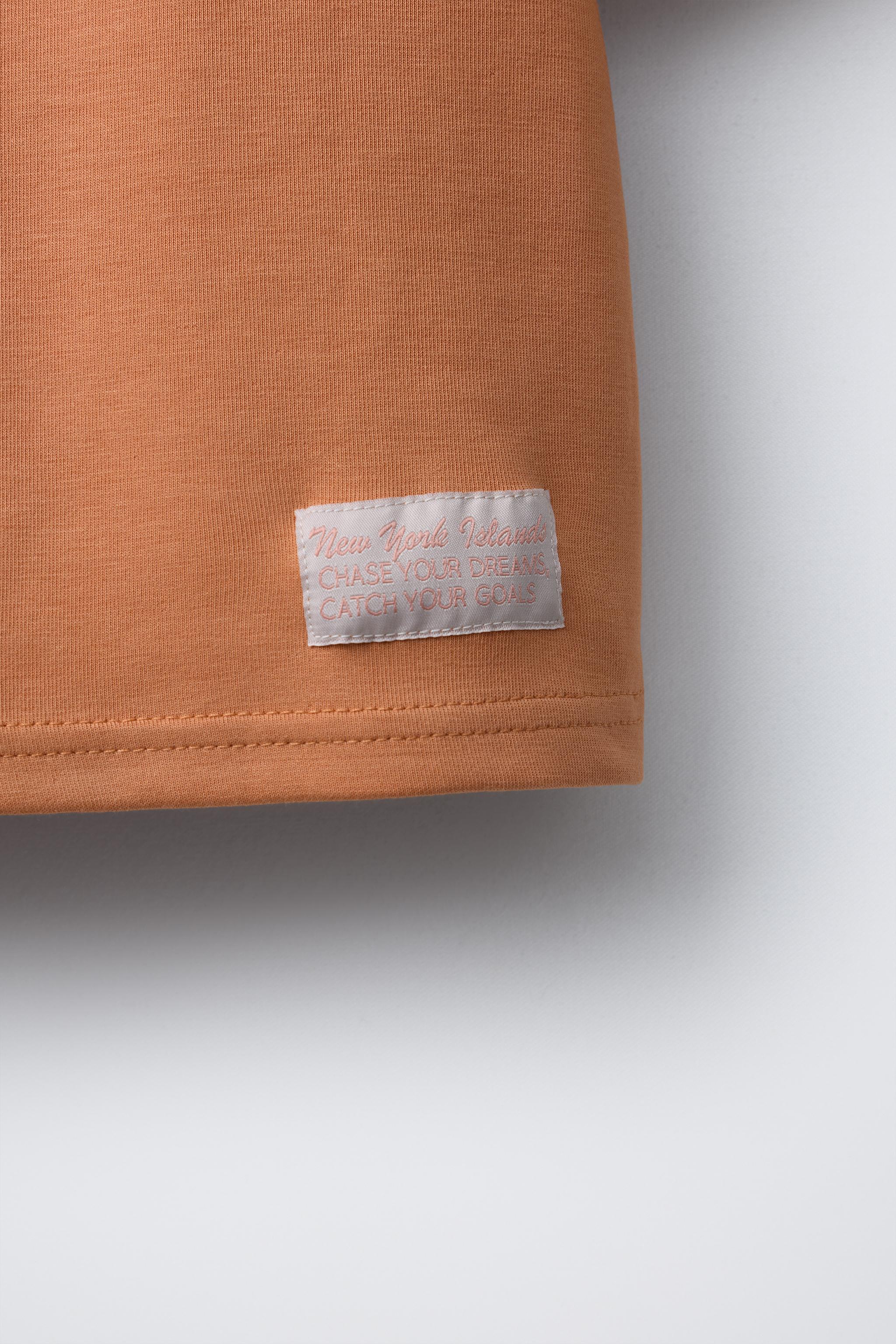 T-SHIRT INTERLOCK À INSCRIPTION